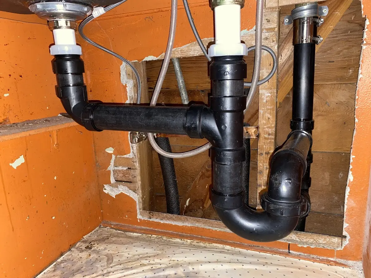 Professional Garbage Disposal Repair equipment and tools on the job in Lytle